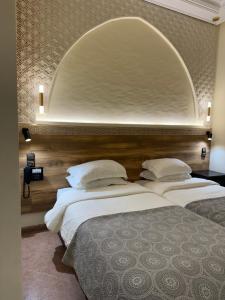 En eller flere senge i et værelse på Hotel Darna Boutique - Newly Renovated