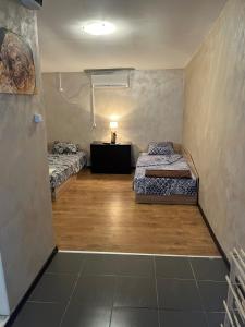 En eller flere senge i et værelse på Стая за нощувки Престиж 3