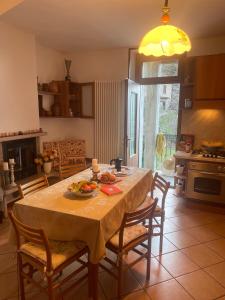 a kitchen with a table with a bowl of food on it at La casa di Mimo in Nesso