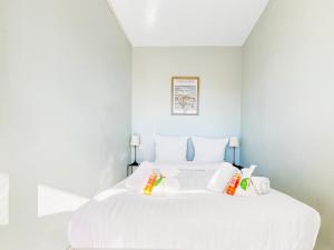 a white bedroom with a large white bed at Cannes Montfleury - Comfortable accommodation Center in Cannes