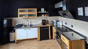 a kitchen with a sink and a counter top at Room 4 - shared house in Linz am Rhein +15 photos