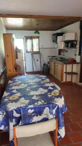 a kitchen with a blue and white table in a room at Amistad in Villa Gesell