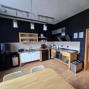a large kitchen with a table and chairs in it at DoubleRoom - work and stay - shared house - 2floor in Linz am Rhein