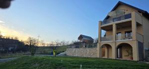 a house on a hill with a building at Kuća za odmor Vista in Slavonski Brod