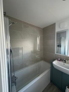 a bathroom with a bath tub and a sink at Faillie in Inverness +27 photos