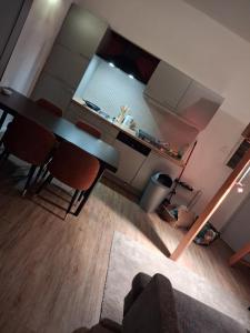 an overhead view of a kitchen with a table and chairs at Apart studio3 in Kortenberg