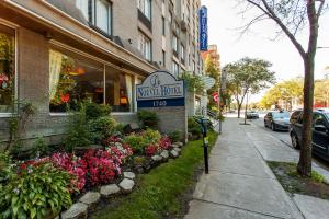 a sign for a water food store on a street at Le Nouvel Hotel in Montreal