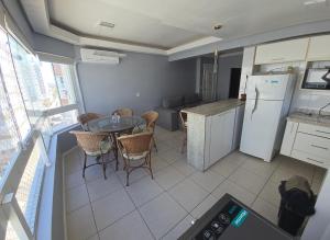 an aerial view of a kitchen with a table and refrigerator at Dona Iva in Capão da Canoa