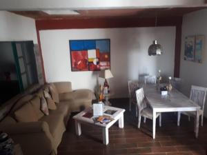 a living room with a couch and a table at Hotel kasa Sarita Centro Historico SMA in San Miguel de Allende