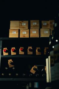 a shelf filled with wooden boxes in a room at Casa Regina, nice position! in Alba