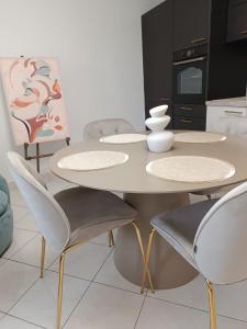 a white table and chairs in a kitchen at Paulla in Šibenik