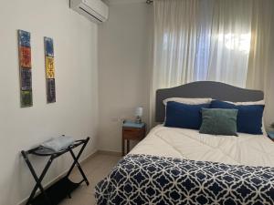 En eller flere senge i et værelse på Villa Fina Aruba