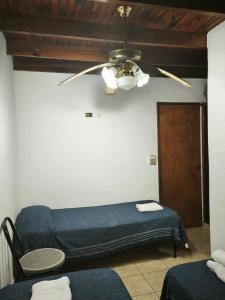 En eller flere senge i et værelse på Hostería Michel