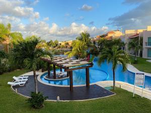 an aerial view of a resort with a pool at Condo Riviera in Puerto Aventuras