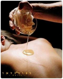 a person is holding a glass of wine at Rubino Private SPA & Room in Corato