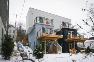 a building with two balconies on it in the snow at trekløveren in Covington