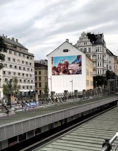 a building with a billboard on the side of it at Naschpark Dream Apartments! in Vienna