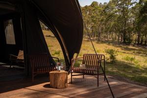 two chairs and a table in front of a tent at Mimosa Wines in Murrah