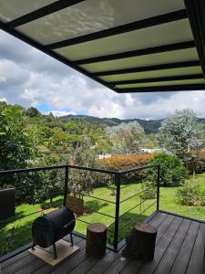 a view from the deck of a house at Equilibrium glamping in Guarne