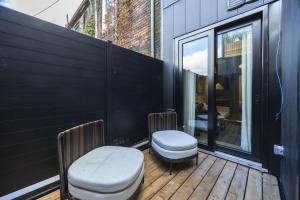 a balcony with two toilets on a wooden deck at The Brick Hotel - The Second Suite in Toronto +12 photos