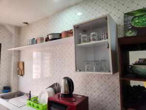 a kitchen with a sink and a counter top at STUDIO NGOR ALAMADIES BAKU plus in Dakar