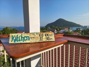 a pillow sitting on a bench on a balcony at M'Pai Bay 23 Ripples Guesthouse and Sky Bar in Koh Rong Sanloem