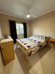 a bedroom with a bed and a window at Complejo Génesis in San José +48 photos