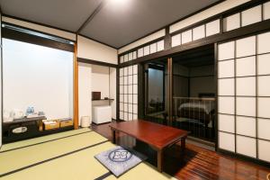 Et tv og/eller underholdning på 天然温泉旅館 繁花荘せせらぎ