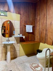 a bathroom with a toilet and a sink at Cabañas La Montaña in Monteverde Costa Rica +114 photos