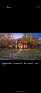 a picture of a house with trees in front of it at Le Monye in Lewisville