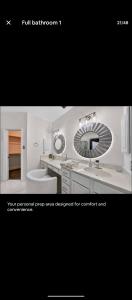 a bathroom with a sink and a mirror at Le Monye in Lewisville