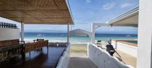 a view of the ocean from a beach house at SARDINEBAY Dive Resort in Moalboal