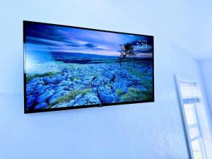 a flat screen tv hanging on a wall at Cozy Twilight Hideaway in Forks