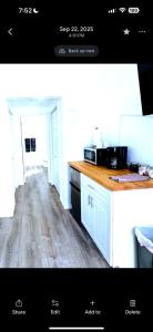 a kitchen with white cabinets and a wooden counter top at Cozy Twilight Hideaway in Forks