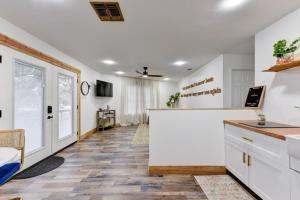 a kitchen with white cabinets and a counter at Independence Bungalow in Wimberley