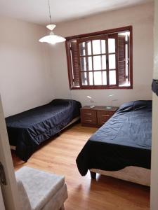 Postel nebo postele na pokoji v ubytování Casa en el centro