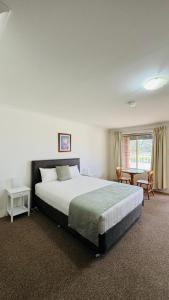 En eller flere senge i et værelse på Marulan Motor Inn + 40 billeder