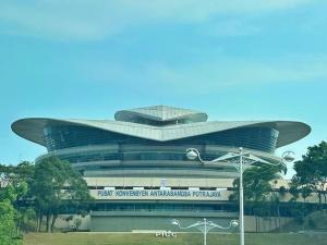 a large circular building with a sign in front of it at PICC Seruling Precinct 5, 62200 Putrajaya 3BR Homestay in Putrajaya
