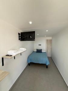 En eller flere senge i et værelse på Don Alberto Departamento 2