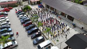 a group of people standing in a parking lot at Reca Resort and Spa in Porac