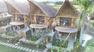 an aerial view of a house with a roof at Reca Resort and Spa in Porac
