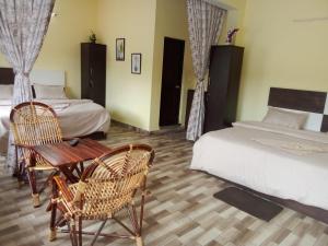 En eller flere senge i et værelse på Jeru Homes