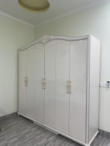a white cabinet in a room with a ceiling at 44 đặng dung in Buon Ma Thuot +14 photos