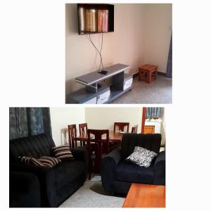 un soggiorno con un divano e un tavolo di Kent City Homes a Hoima