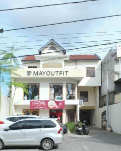a white van parked in front of a building at Elmo Living in Yogyakarta