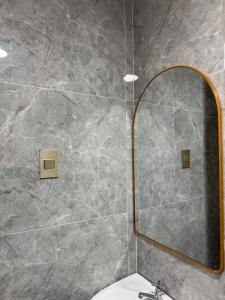 a bathroom with a mirror and a sink at BLJ Homes in Angatan +25 photos