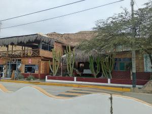 a building with a skate park in front of it at Black Marlin - Restaurant and Lodge in Talara