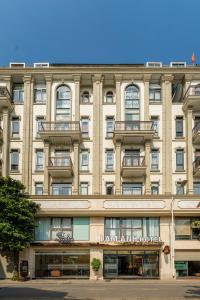 a large building with balconies on top of it at Lam Anh Hotel 9 Him Lam Vạn Phúc in Hà Ðông