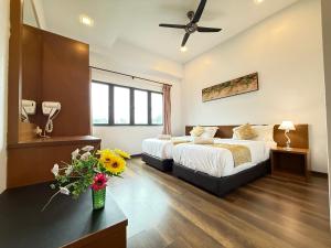 En eller flere senge i et værelse på Nova Mountain n Sunrise view Hilltop Hotel Apartment in Cameron Highlands + 100 billeder