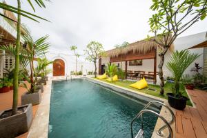 a pool in a house with trees and plants at Saltera Kedungu in Tanah Lot +18 photos